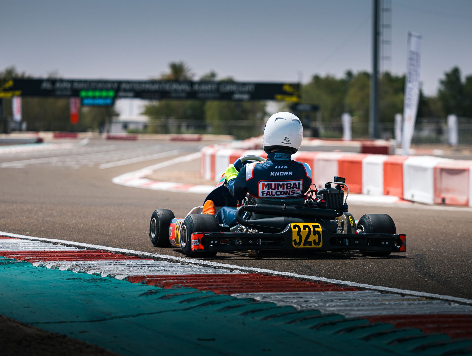 Damian Knorr #325 exiting a corner at Al Ain Raceway, Rotax Invitational