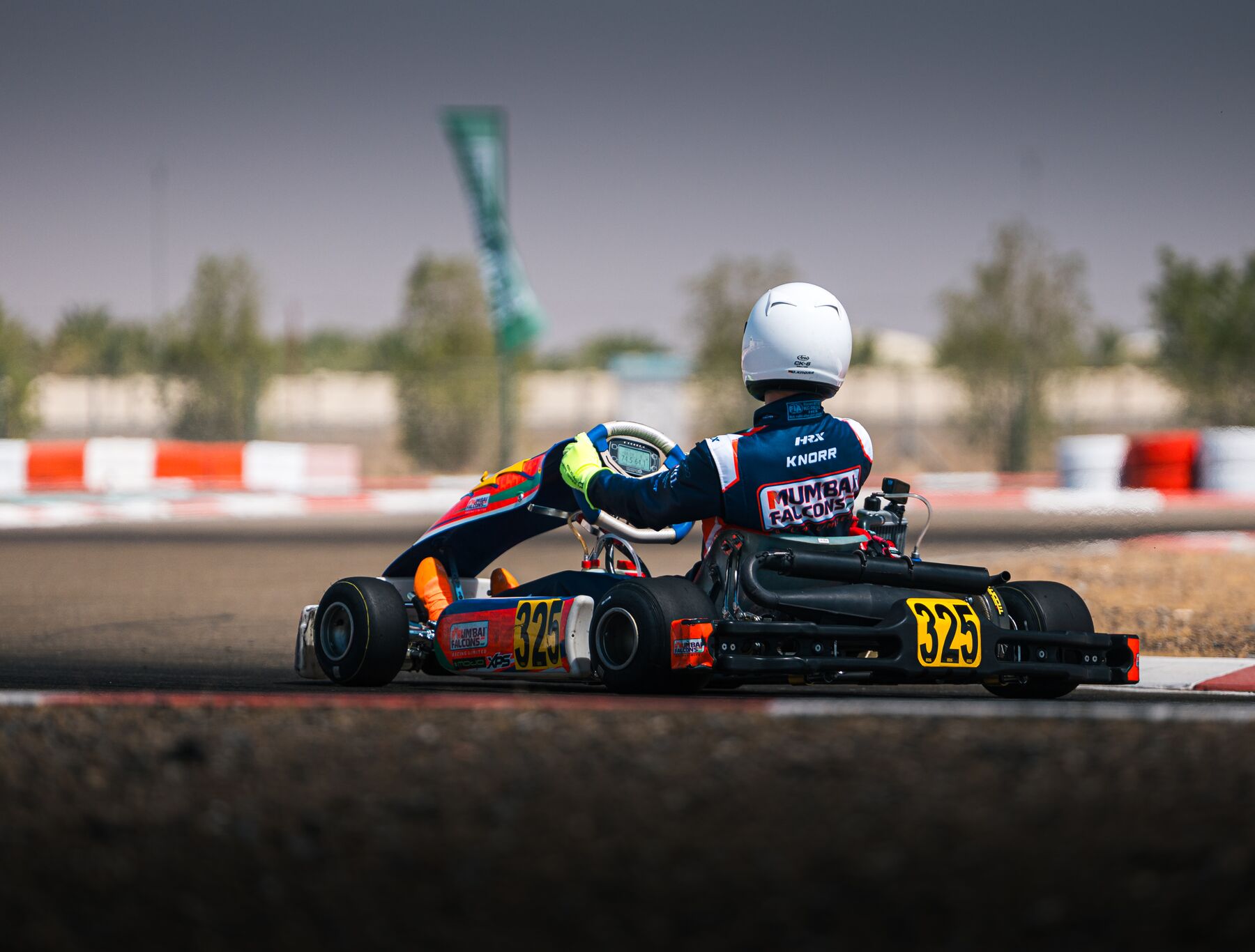 Kart #325 from behind on the Al Ain circuit