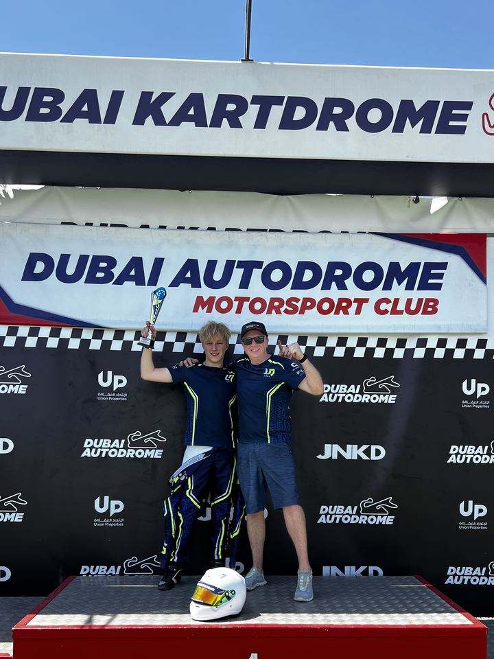 Damian Knorr and Vitali celebrating P2 on the podium at Dubai Kartdrome