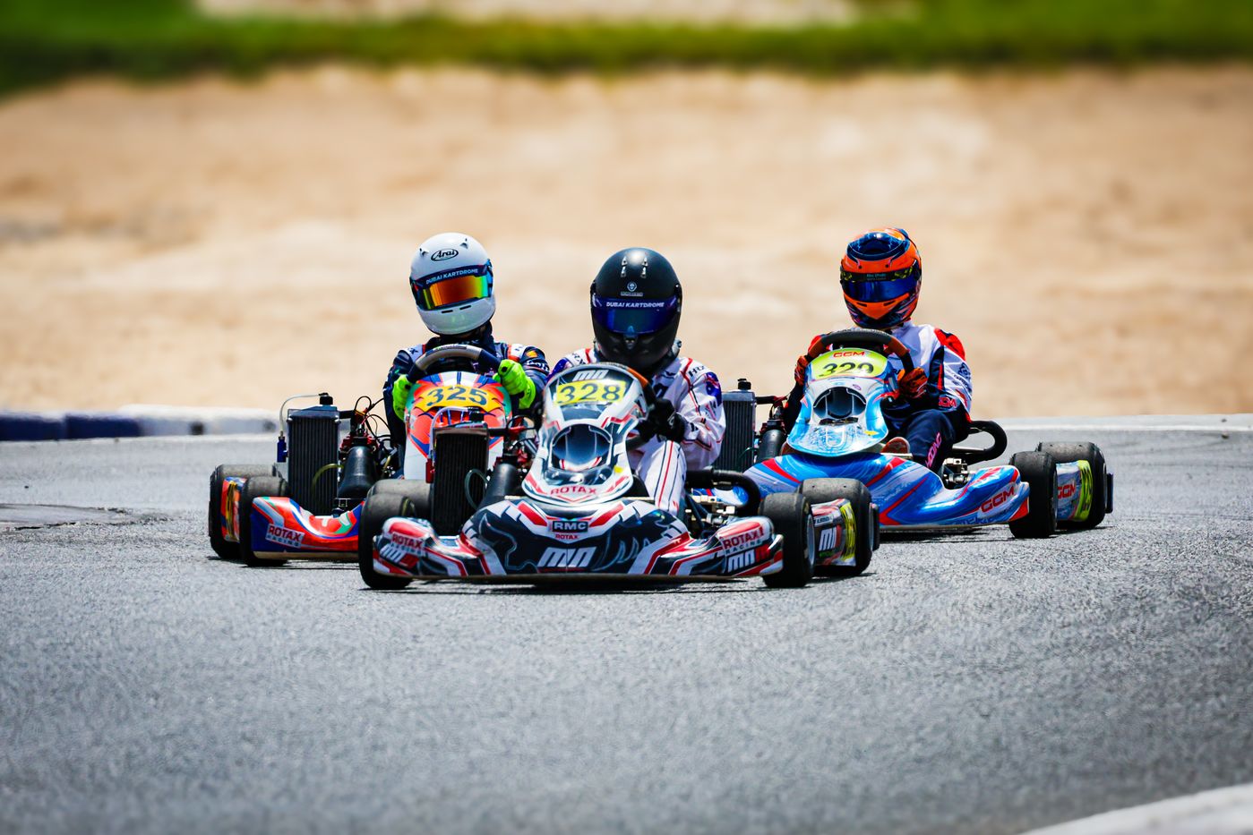 Damian Knorr #325 and rivals cornering at Dubai Kartdrome, DAMC Round 1
