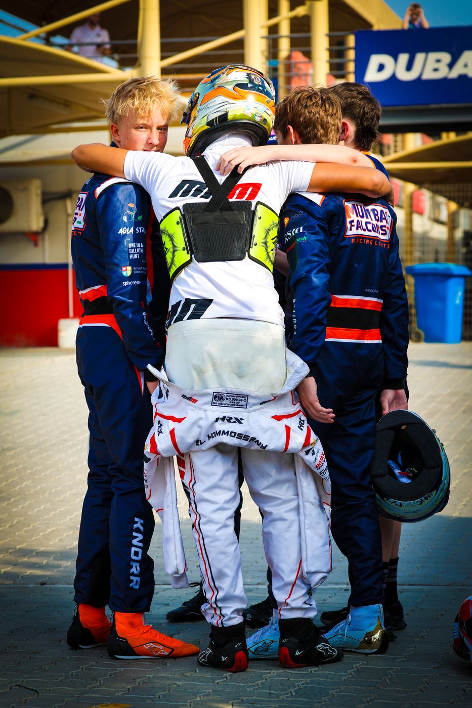 Mumbai Falcons Racing team celebrating in the paddock