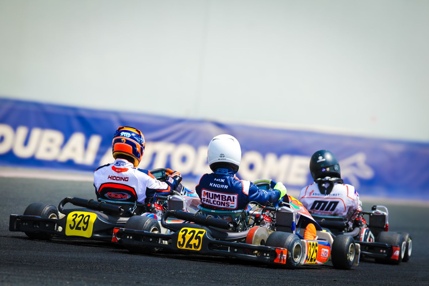 Damian Knorr #325 racing three-wide, Dubai Kartdrome